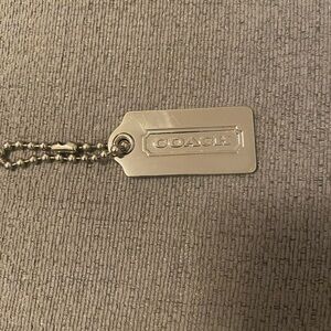 Coach metallic Silver tag